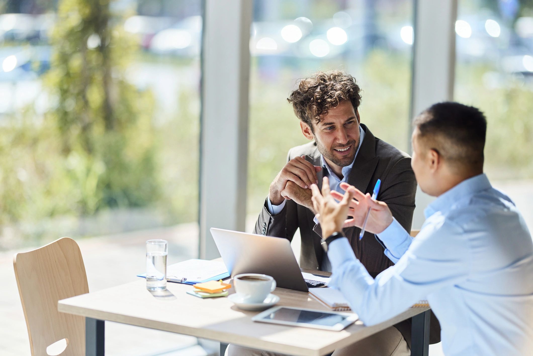 Two professionals collaborating in a coaching session