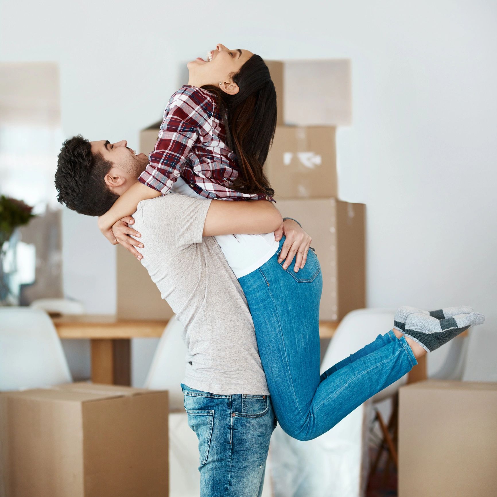 Smiling couple in a new home